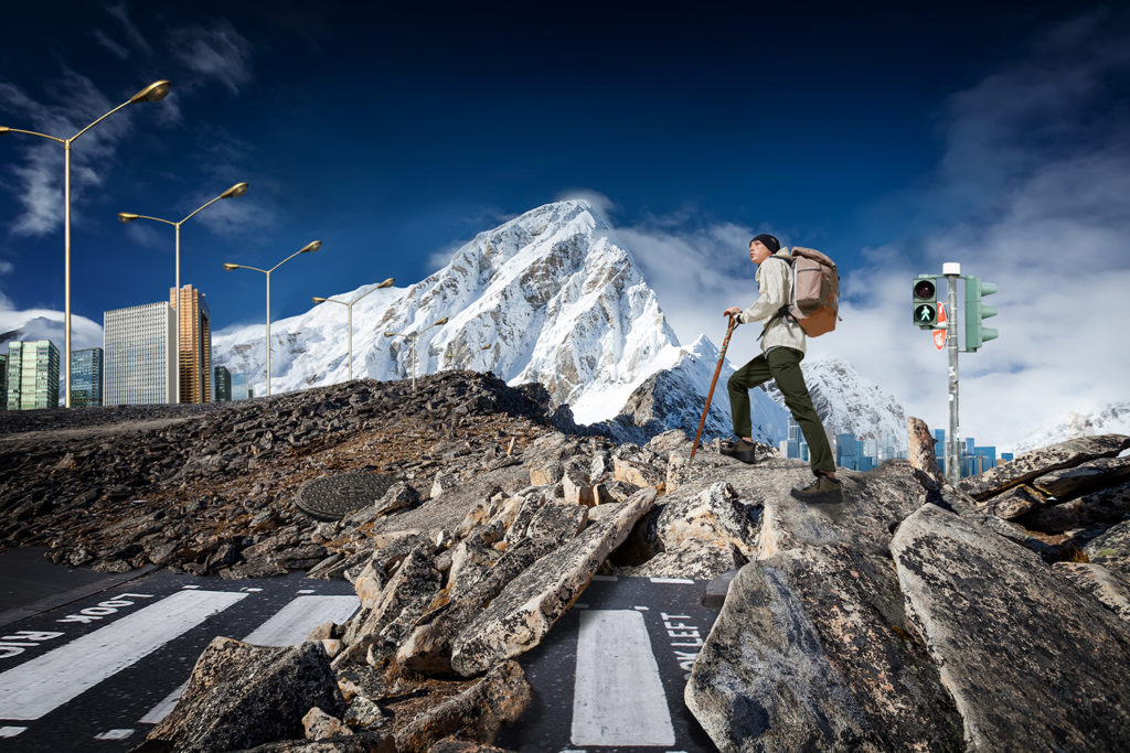 Hiker walks on train in Himalayas